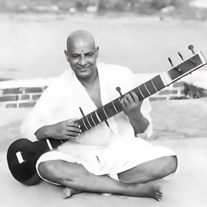 Swami Sivananda playing veena with joyful devotion