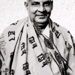 Swami Sivananda smiling wearing sacred spiritual shawl