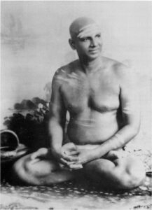 Swami Sivananda meditating with serene spiritual presence