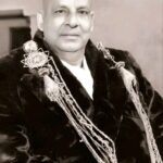 Swami Sivananda Saraswati wearing ceremonial academic robes
