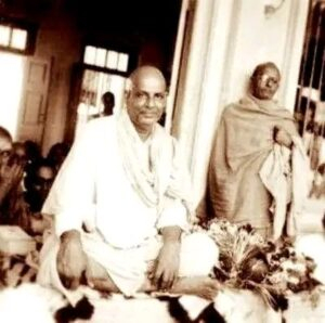 Swami Sivananda blessing devotees with serene compassion
