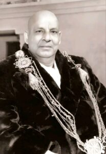 Swami Sivananda Saraswati wearing ceremonial academic robes