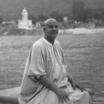 Swami Sivananda seated beside Ganga river image