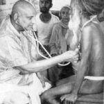 Swami Sivananda compassionately serving spiritual seekers selflessly