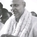 Swami Sivananda sharing timeless Vedanta wisdom peacefully