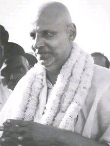 Swami Sivananda sharing timeless Vedanta wisdom peacefully