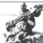 Swami Sivananda playing veena inspiring devotional meditation