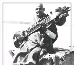 Swami Sivananda playing veena inspiring devotional meditation