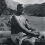 Swami Sivananda meditating beside Ganges in Himalayas