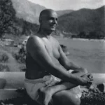 Swami Sivananda meditating beside Ganges in Himalayas