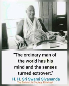 Smiling Swami Sivananda sharing spiritual wisdom