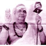 Swami Sivananda blessing devotees with raised hand