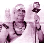 Swami Sivananda blessing devotees with raised hand