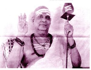 Swami Sivananda blessing devotees with raised hand