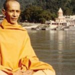 Peaceful monk embracing sannyasa beside sacred riverside spiritual retreat