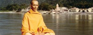 Peaceful monk embracing sannyasa beside sacred riverside spiritual retreat