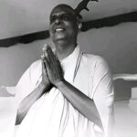 Swami Sivananda offering joyful prayerful greetings warmly