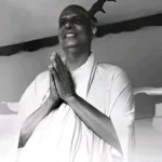 Swami Sivananda offering joyful prayerful greetings warmly