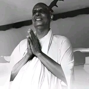 Swami Sivananda offering joyful prayerful greetings warmly
