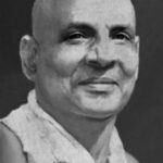Black and white close up of Sivananda.