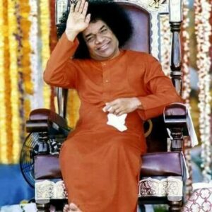 Shri Sathya Sai Baba blessing devotees smiling