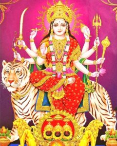 Goddess Durga seated on tiger with divine weapons and sacred blessings