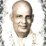 Swami Sivananda smiling with serene spiritual wisdom