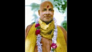 Manasic Puja spiritual guru wearing garland and sacred shawl peacefully