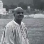 Swami Sivananda beside the sacred Ganges river