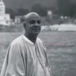 Swami Sivananda beside the sacred Ganges river