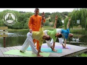 Gayatri Japa yoga instructor guiding students practicing outdoor poses together