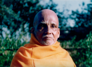 Portrait of Hindu monk in saffron robes during spiritual contemplation