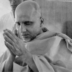 Hindu monk offering prayer with folded hands and peaceful devotion