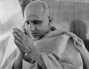 Hindu monk offering prayer with folded hands and peaceful devotion