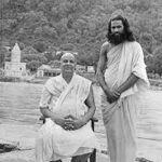 Swami Sivananda with disciple beside Ganga at Rishikesh