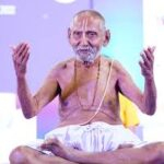 Swami Sivananda teaching during yoga meditation session