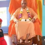 Swami Sivananda seated on ceremonial chair