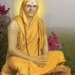 Swami Sivananda seated with radiant divine aura