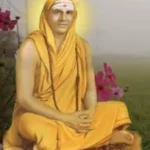 Swami Sivananda seated with radiant divine aura