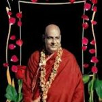 Swami Sivananda teaching Karma Yoga principles