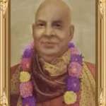 Yama spiritual guru portrait adorned with colorful flower garland