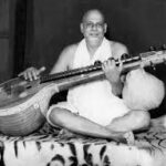 Swami Sivananda playing veena peacefully