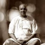 Swami Rama Tirtha meditating peacefully seated