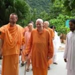 Spiritual master walking with devoted disciples in harmony