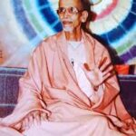 Serene spiritual teacher inspiring devoted prayer through peaceful wisdom