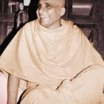 Smiling Hindu monk seated peacefully in meditation posture