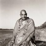 Swami Sivananda seated wearing sacred garlands image