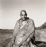 Swami Sivananda seated wearing sacred garlands image