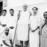 Revered spiritual teacher with devotees image
