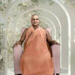 Swami Sivananda seated peacefully symbolizing God's existence